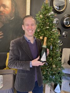 Trevor Clough holding Digby House of Commons Bottle