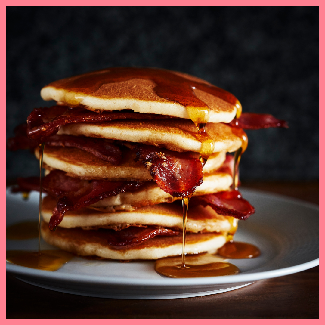 American pancakes with crispy bacon and maple syrup