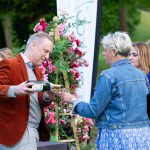 CEO Trevor Clough pouring wine for guests at Arundel Castle.